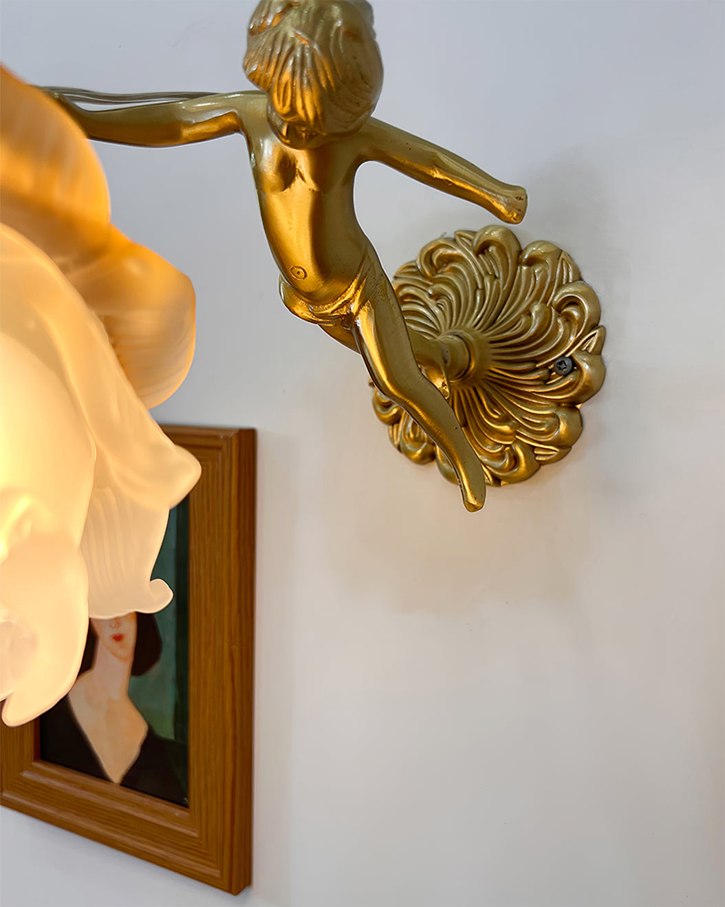 antique-brass-wall-sconce-with-angel-figurine-detail-img7.jpg