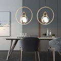 modern-rotating-gold-pendant-light-for-kitchen-island-img1.jpg