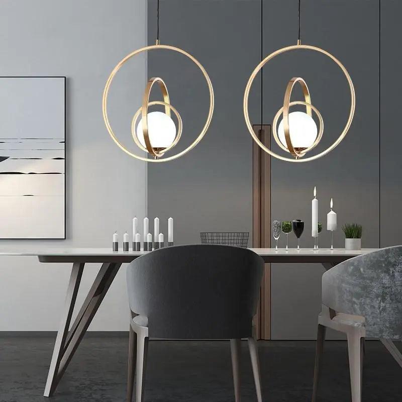 modern-rotating-gold-pendant-light-for-kitchen-island-img1.jpg