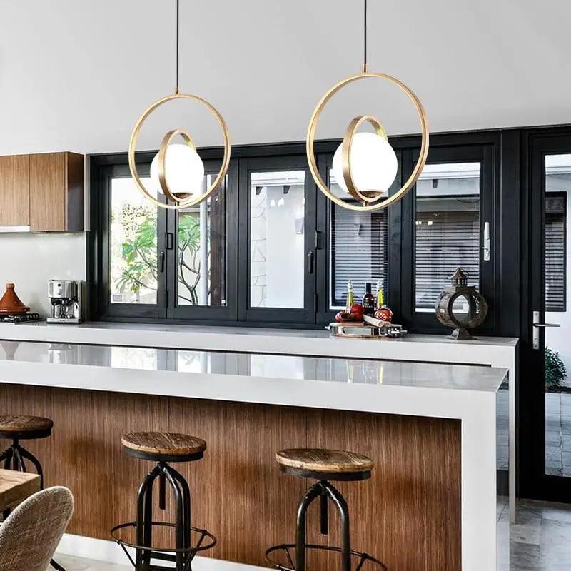 modern-rotating-gold-pendant-light-for-kitchen-island-img2.jpg