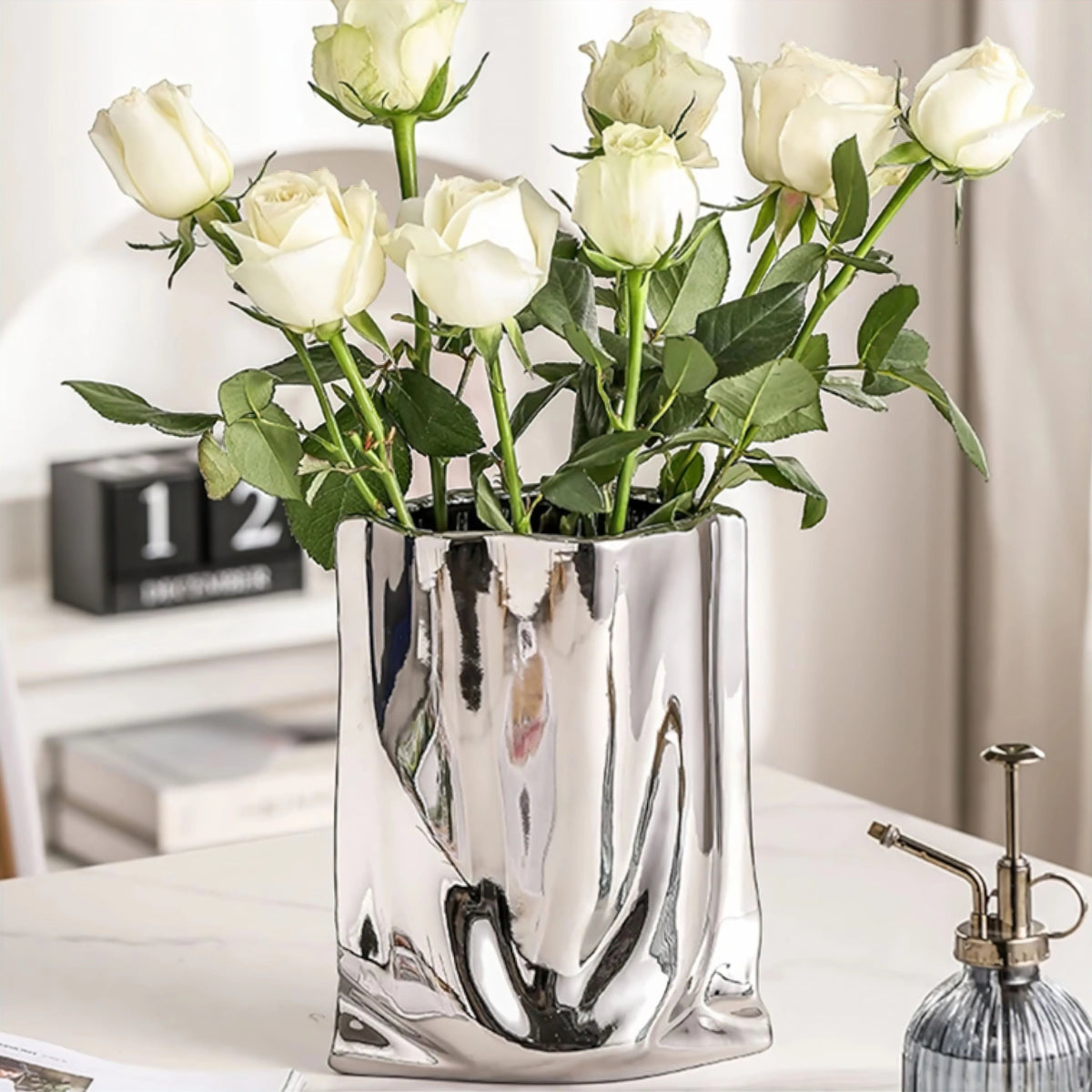 molten-silver-resin-vase-with-fluid-metallic-form-img3.webp