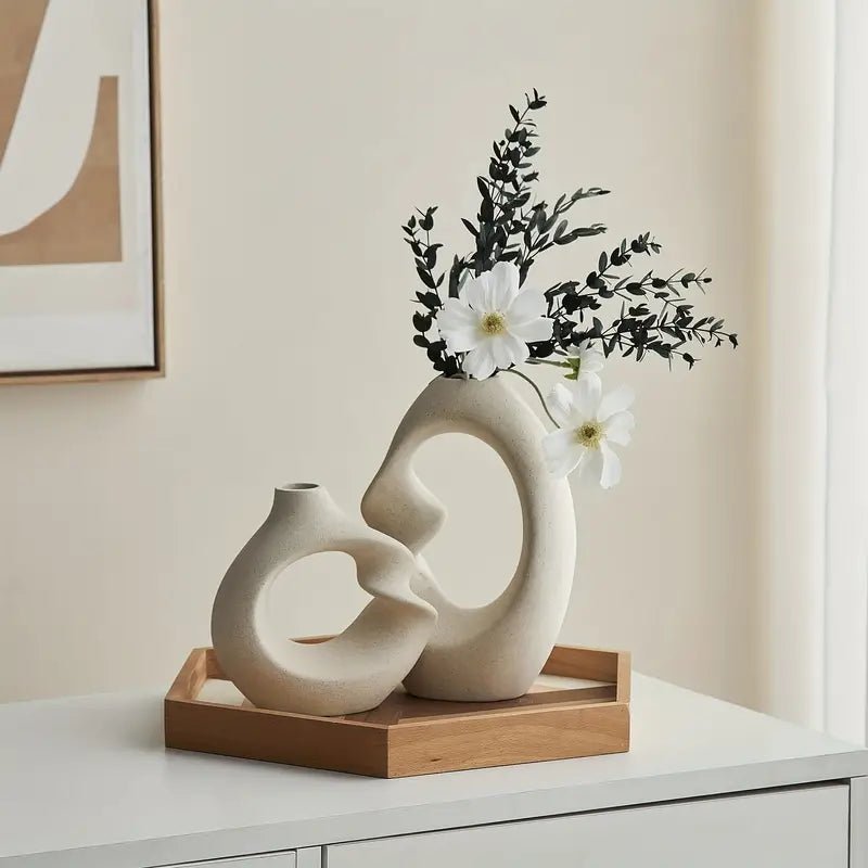 sculpted-ceramic-vase-set-with-abstract-curved-design-img1.webp