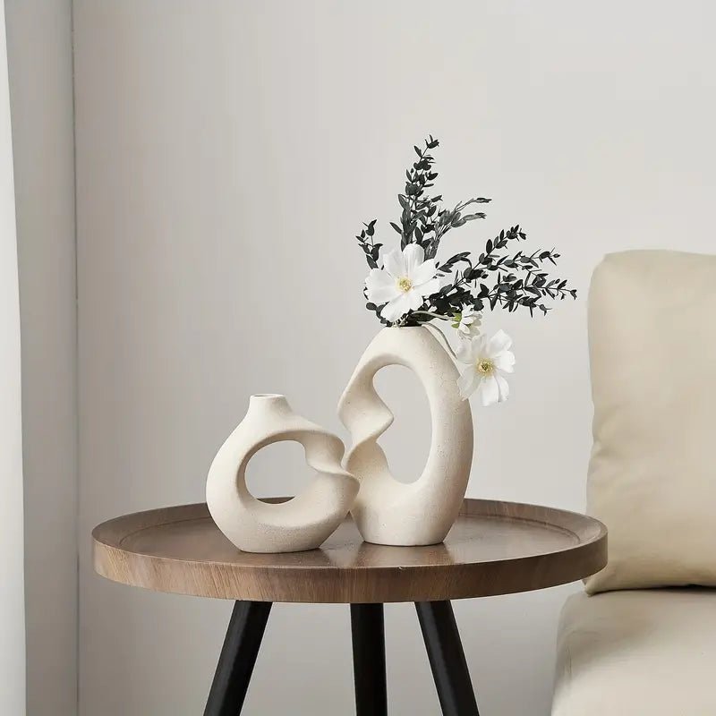 sculpted-ceramic-vase-set-with-abstract-curved-design-img2.webp