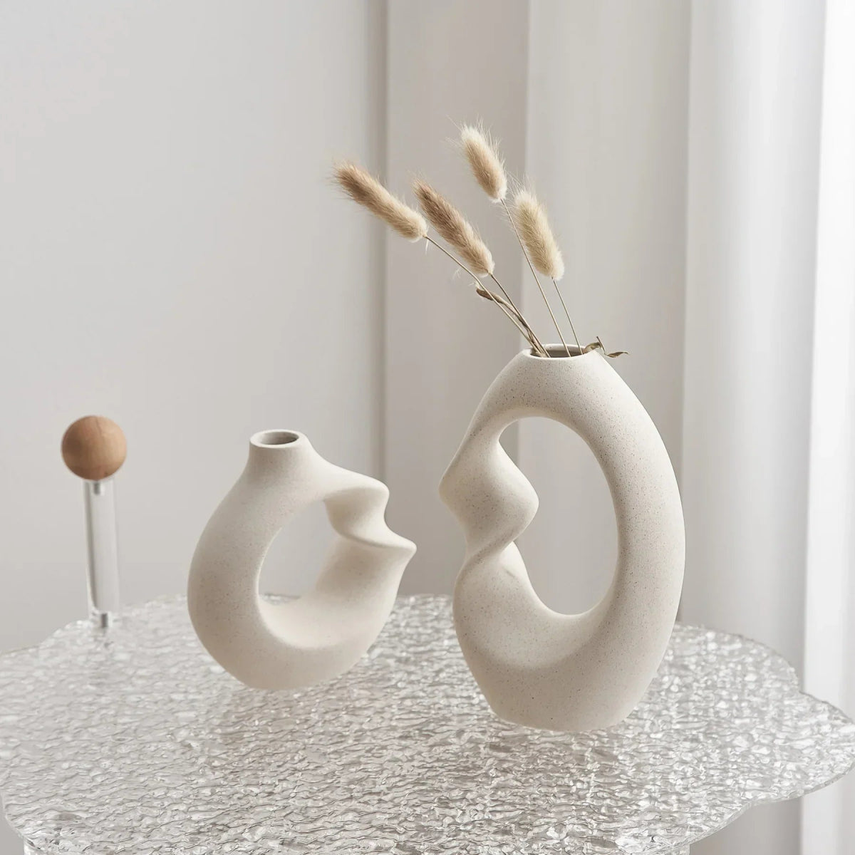 sculpted-ceramic-vase-set-with-abstract-curved-design-img3.webp