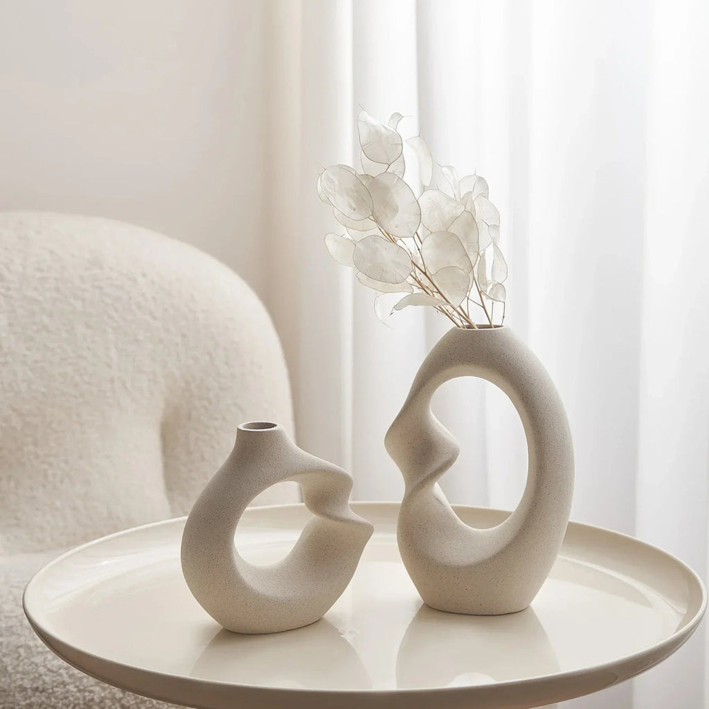 sculpted-ceramic-vase-set-with-abstract-curved-design-img5.webp